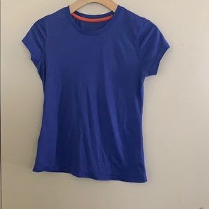 purple athletic shirt.